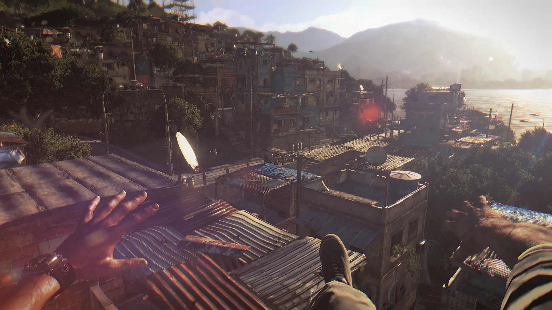 Kyle Crane standing completely still on a high rooftop, looking out over the sprawling, sun-baked slums of Harran.