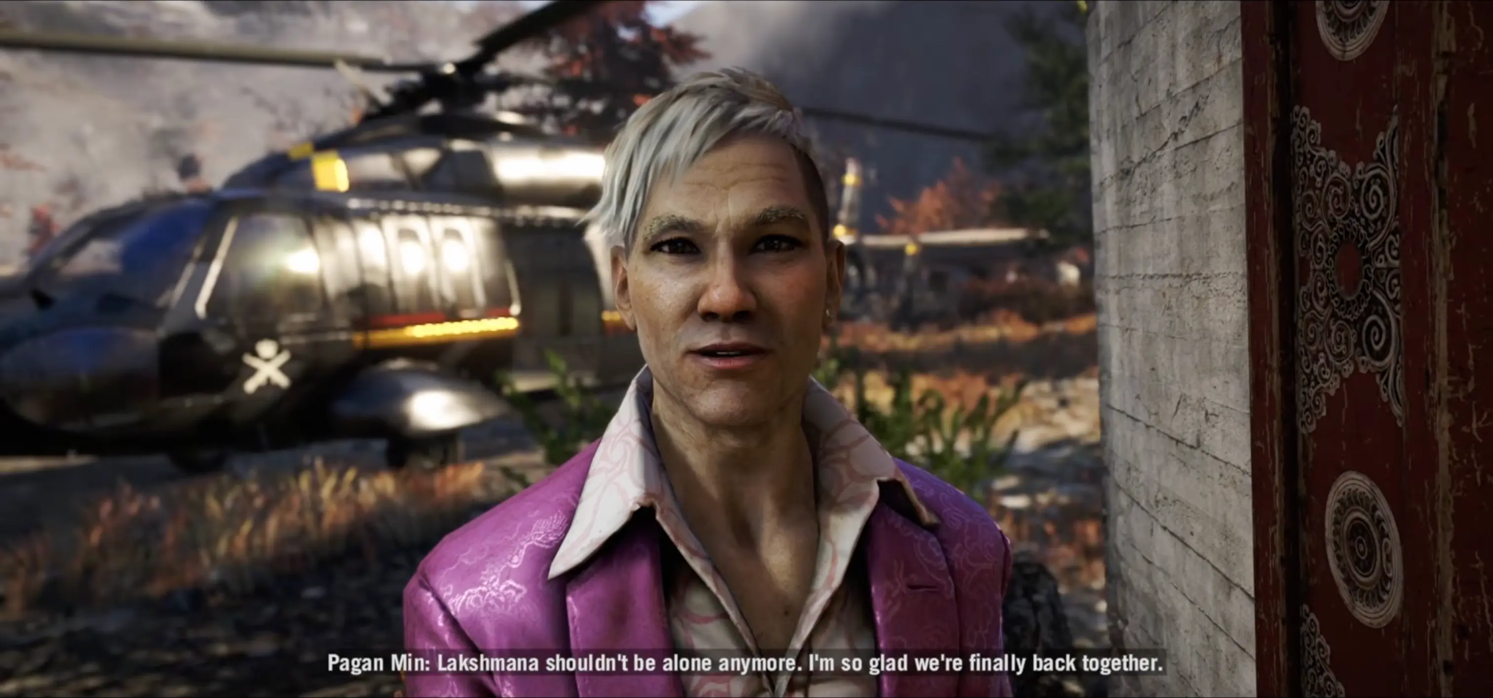Pagan Min and Ajay Ghale standing peacefully at a mountainside shrine, a scene from the game's brilliant 15-minute secret alternate ending.
