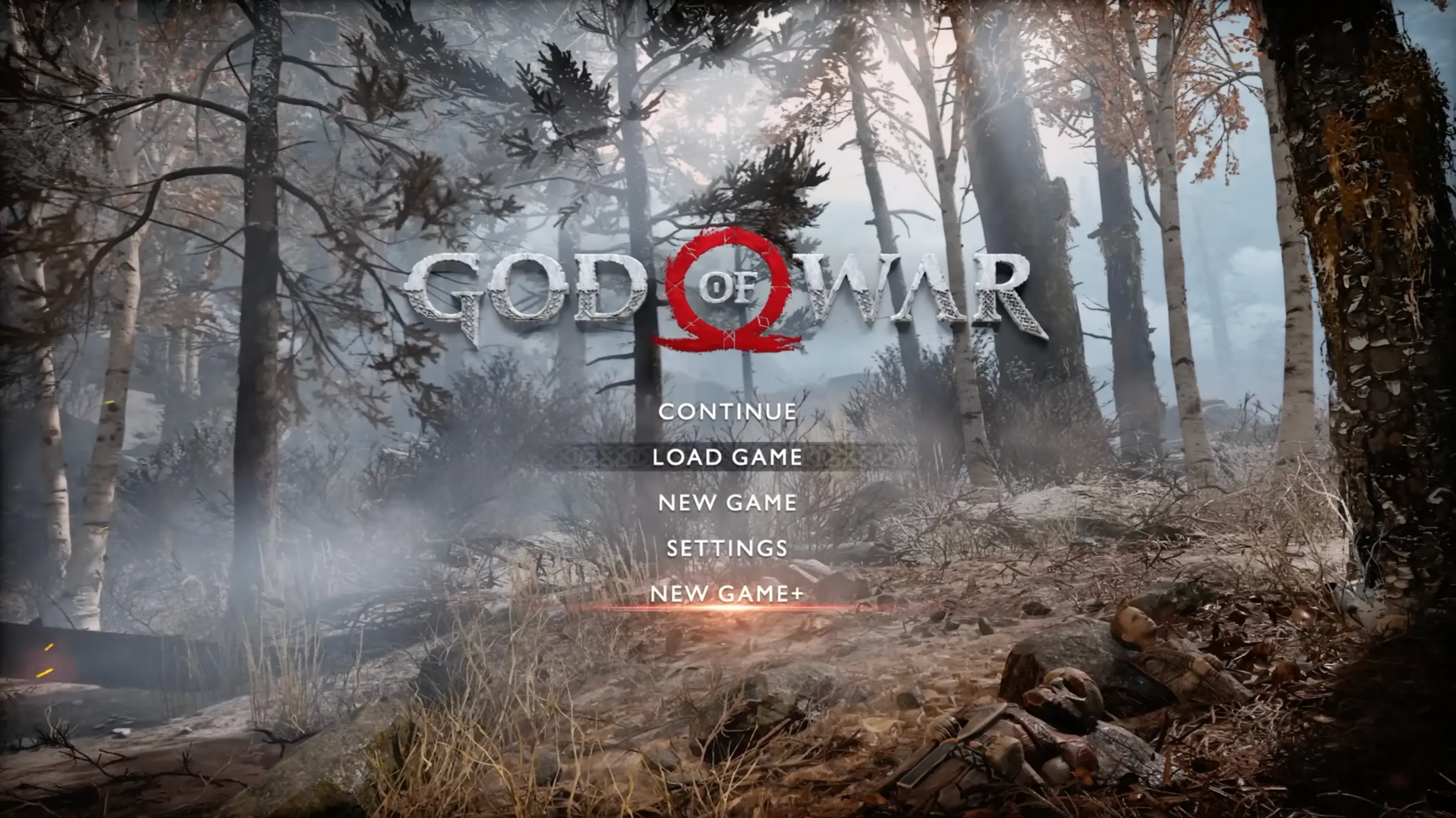 The official main menu of God of War, showing Kratos and Atreus silently standing in the snow before their cabin.