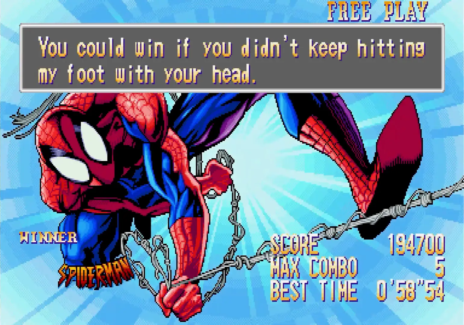 Spider-Man striking a victory pose, hanging upside down from a web after winning a hard-fought match.