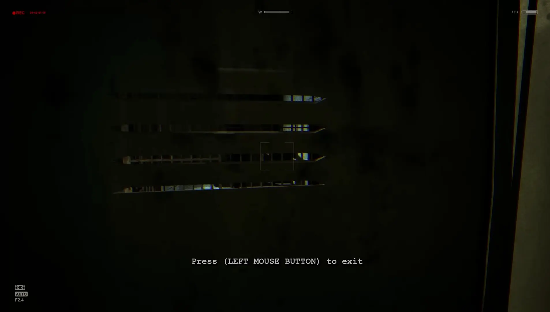 The first-person perspective of Miles hiding inside a metal locker, peering out through the slats as a mutilated inmate searches the room.
