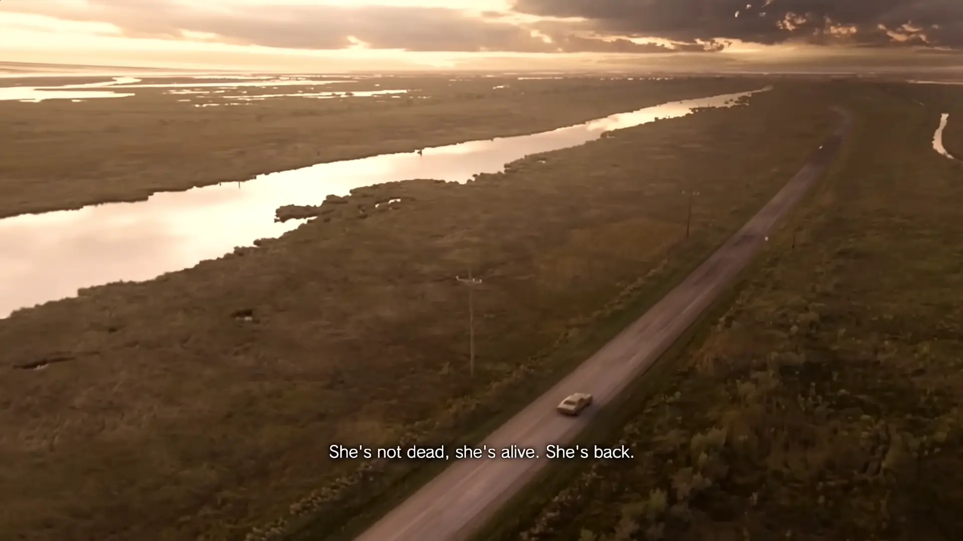 The opening scene: Ethan Winters in his car, looking at the 'Come get me' video message from Mia on his laptop.