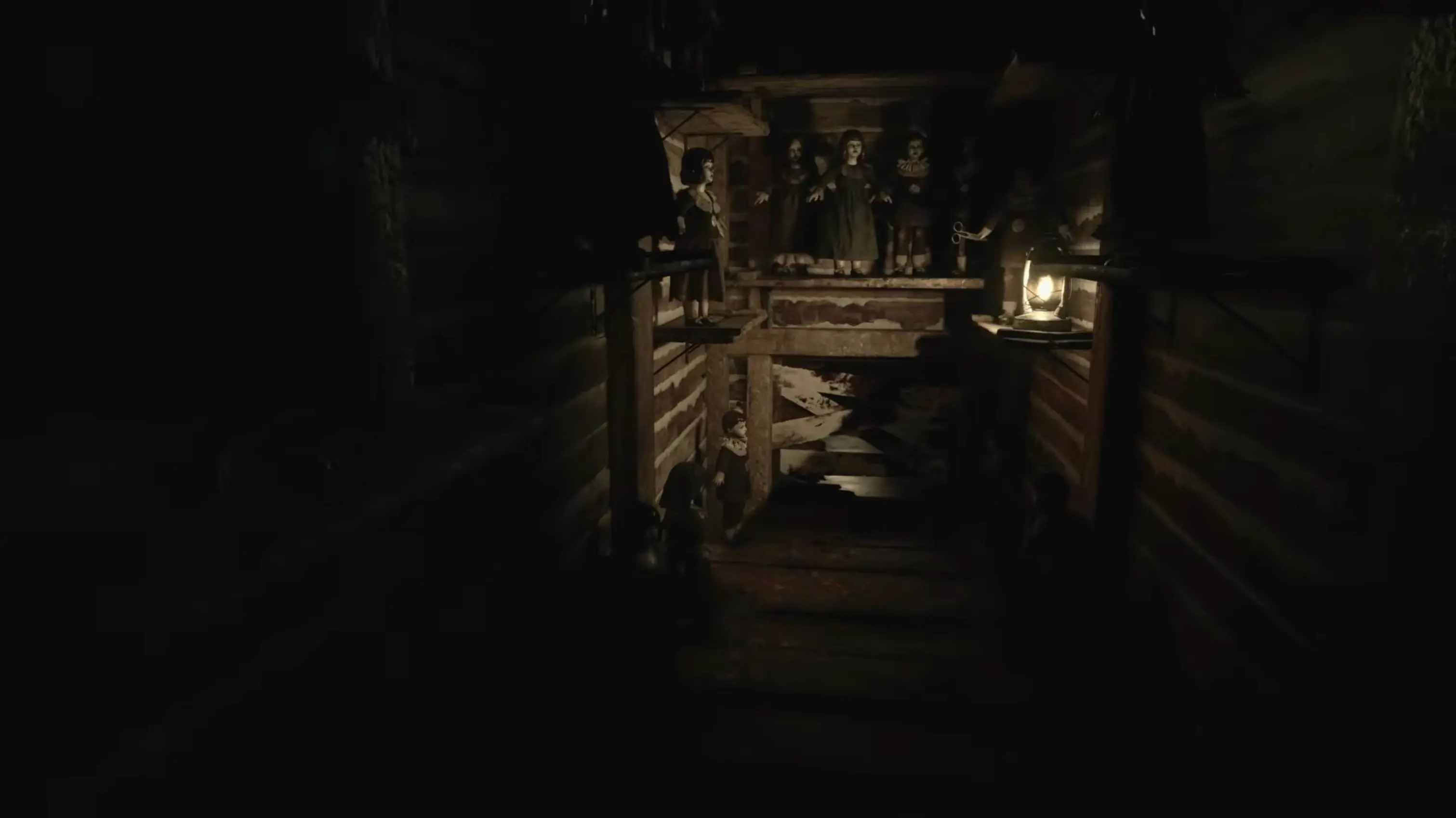 A deeply unsettling, dimly lit hallway inside House Beneviento, filled with creepy dolls staring blankly into space.