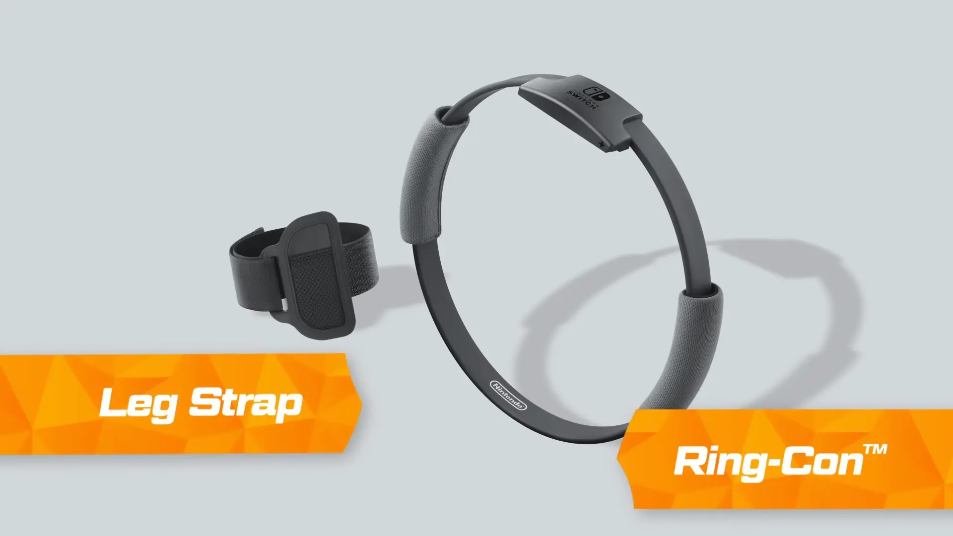 A sleek studio shot of the Ring-Con and Leg Strap accessories with neon Joy-Cons attached.