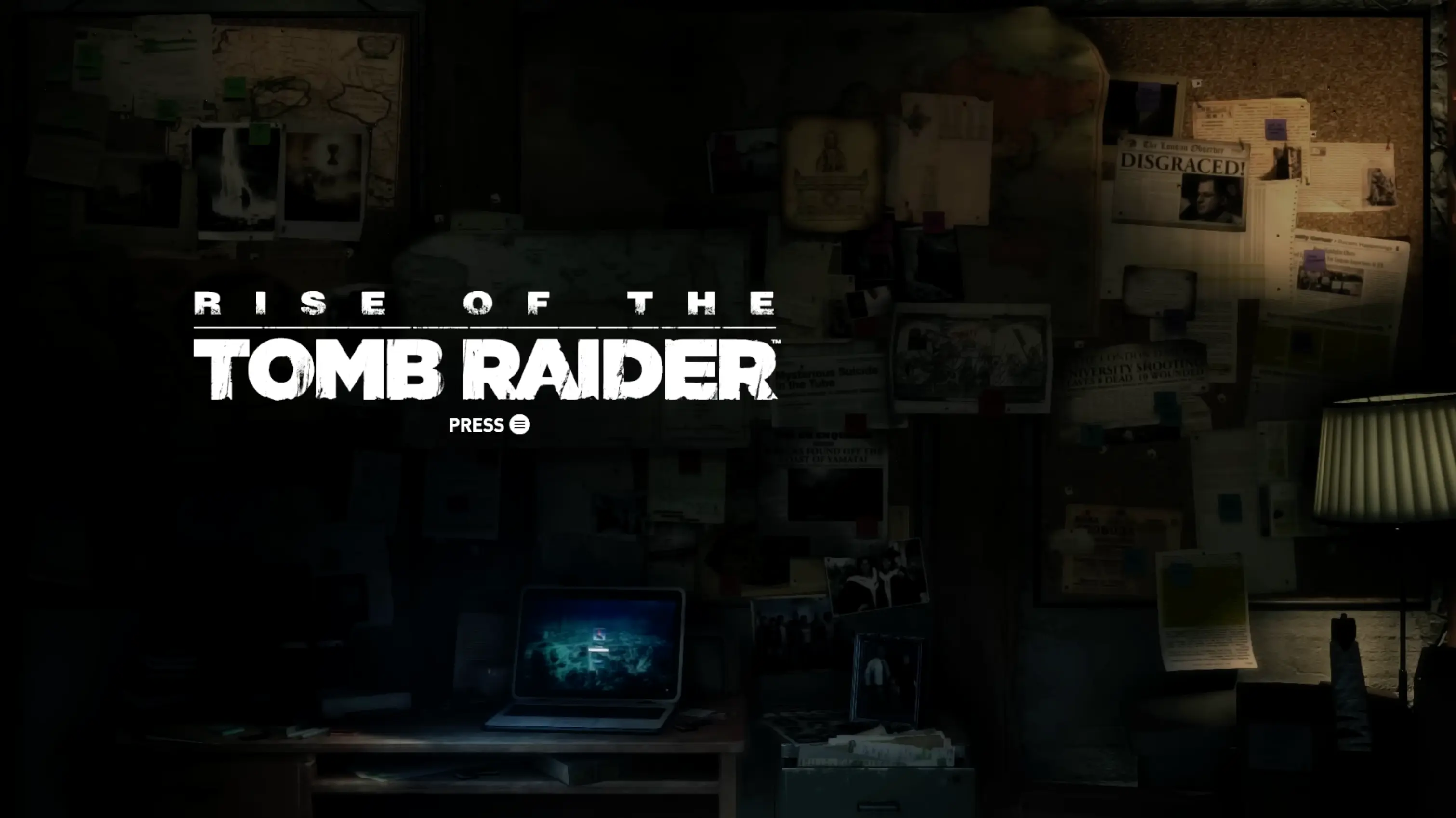 The main menu of Rise of the Tomb Raider, showing a gritty, determined Lara Croft sitting in a dark cave illuminated by the warm glow of a campfire.