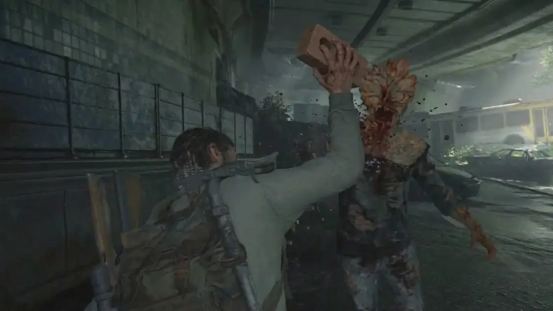 Joel mid-swing, smashing a brick into the face of a rushing Runner in a dark, spore-filled basement.