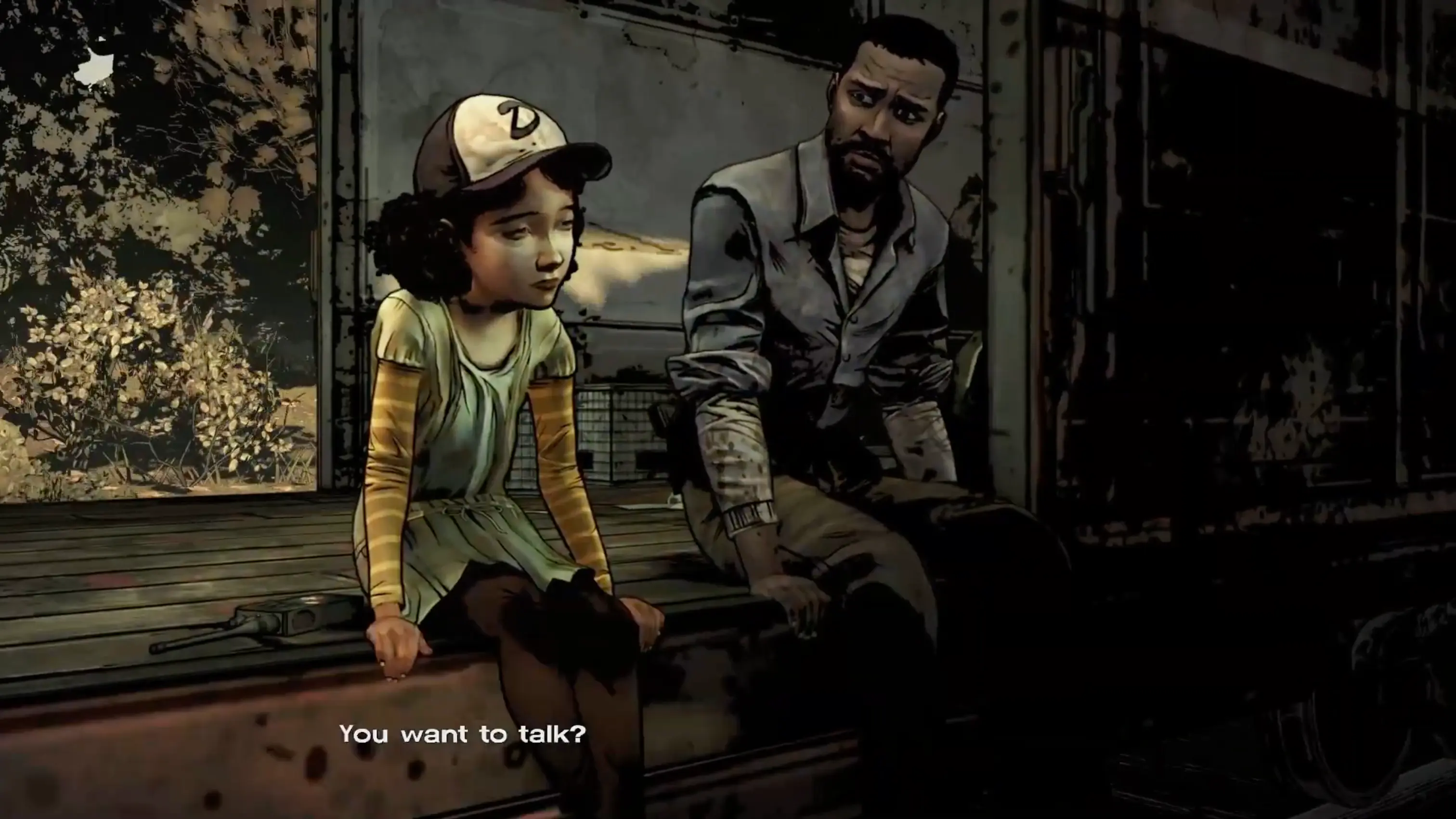 Lee and Clementine walking down a desolate, abandoned train track as the sun sets.