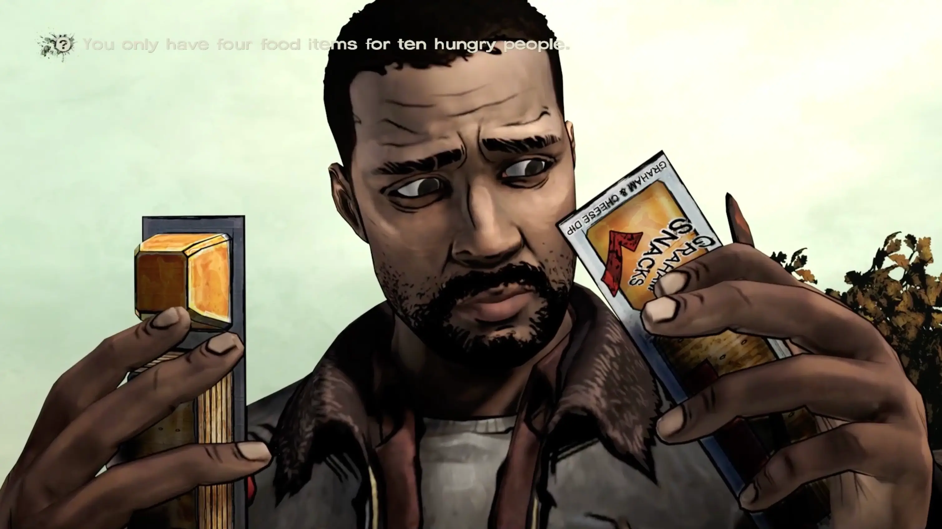 Lee looking at a small basket containing a few pieces of food, forced to decide who gets to eat today.