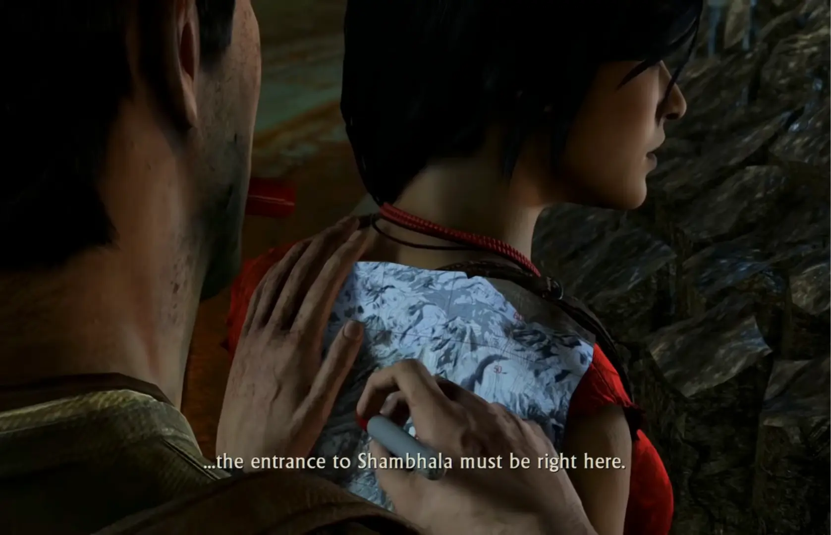 Nate and Chloe arguing over a map in an old temple.