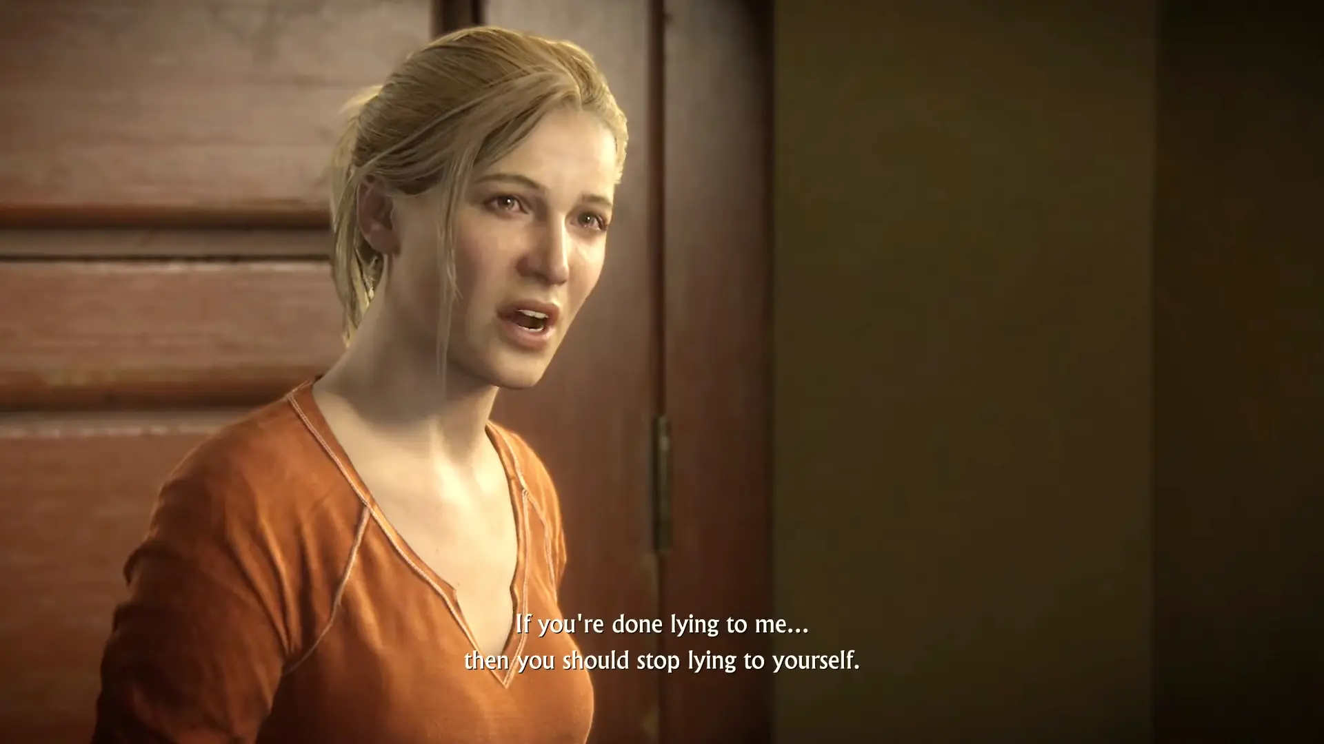 A tense emotional moment between Nate and Elena in a hotel room.