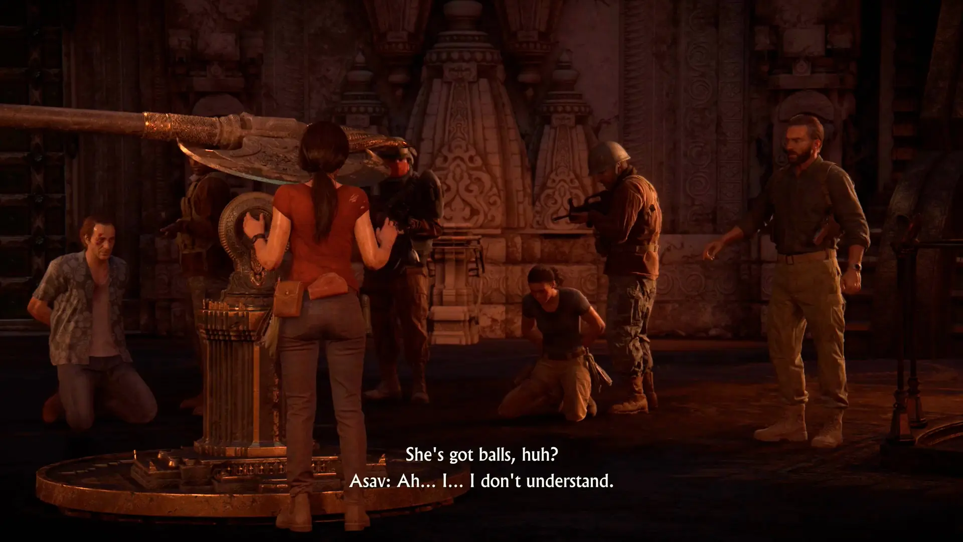 A tense face-off between Chloe, Nadine, and the antagonist Asav in an ancient temple.