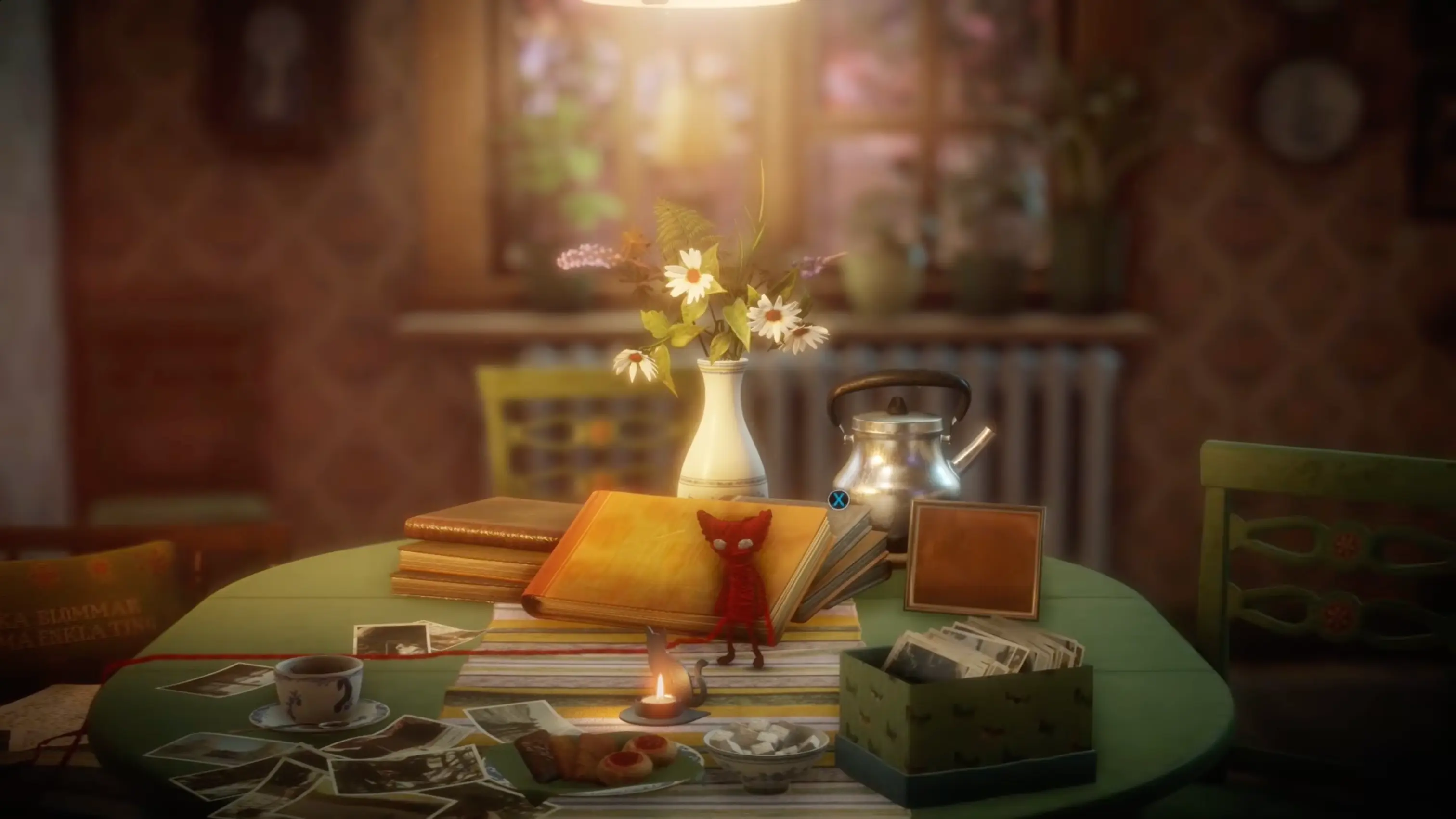 Yarny standing on a wooden table next to an old photograph in a sunlit, cozy room.