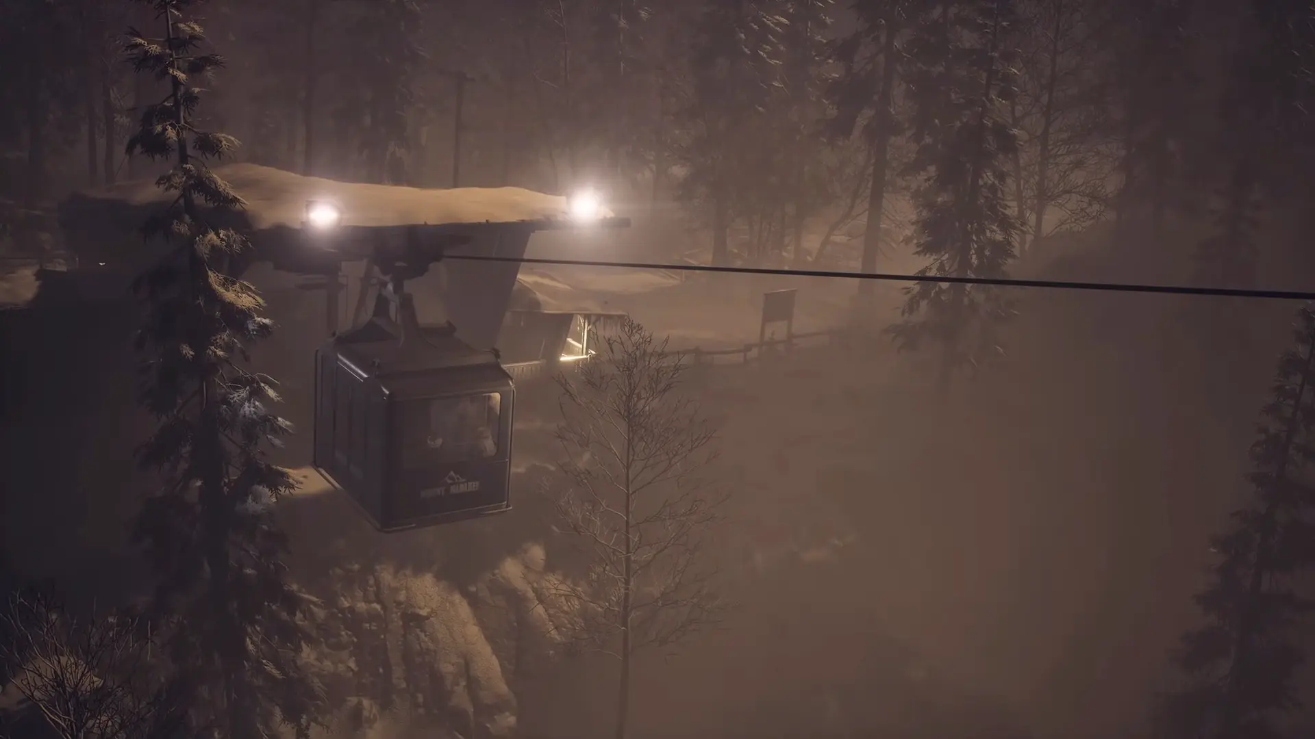 The rusted cable car station at the base of the mountain, surrounded by a raging blizzard, emphasizing the characters' isolation.