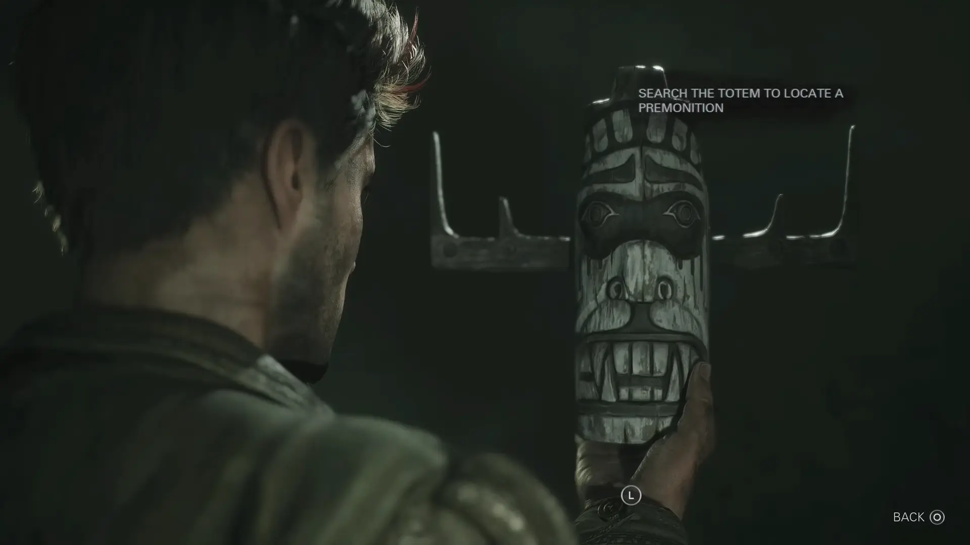 A black Death Totem resting in the snow, glowing faintly, waiting to show the player a vision of a brutal demise.