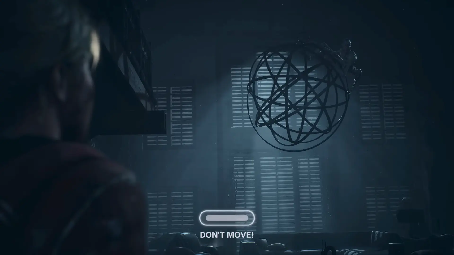 A blue 'Don't Move' prompt on screen, with a Wendigo breathing just inches from Sam's face as she hides against a wooden pillar.