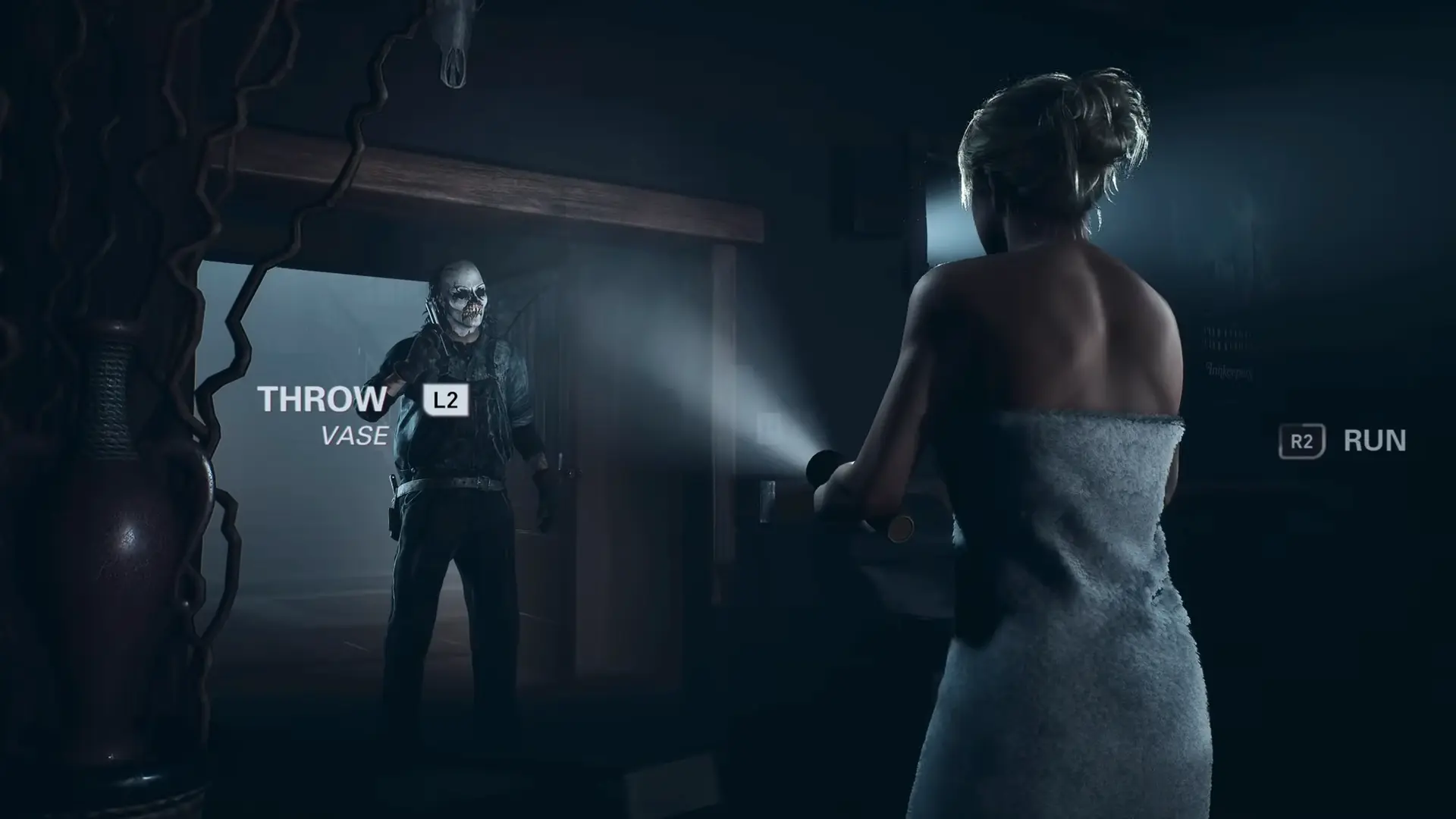 Sam running through the lodge in her towel, a desperate and iconic final-girl survival moment.